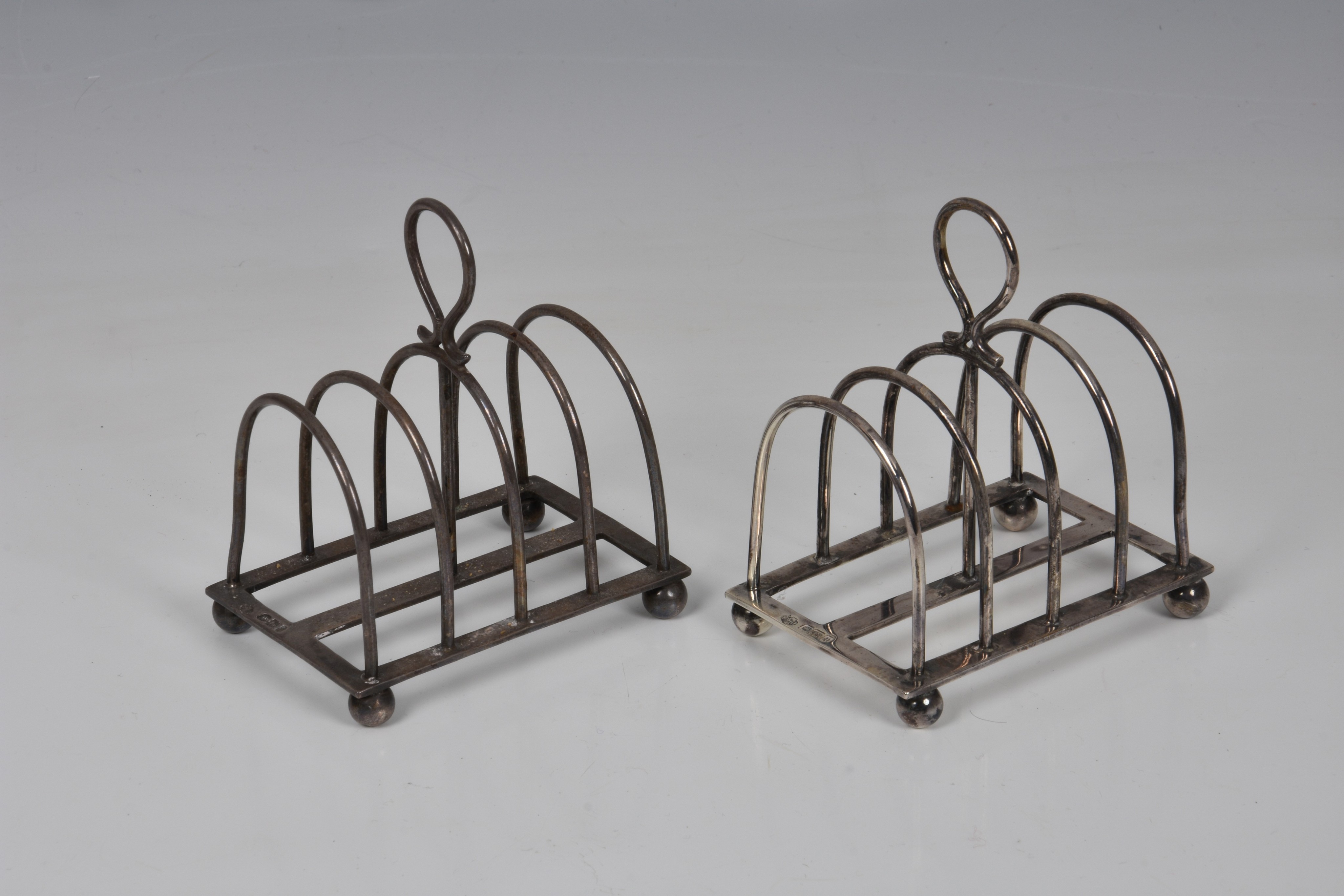 A pair of George V silver four division toast racks, William Hutton & Sons Ltd., Sheffield 1913,