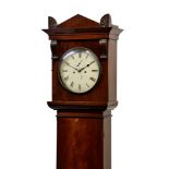 An early 19th century mahogany eight day longcase clock, the bell strike movement fronted by a