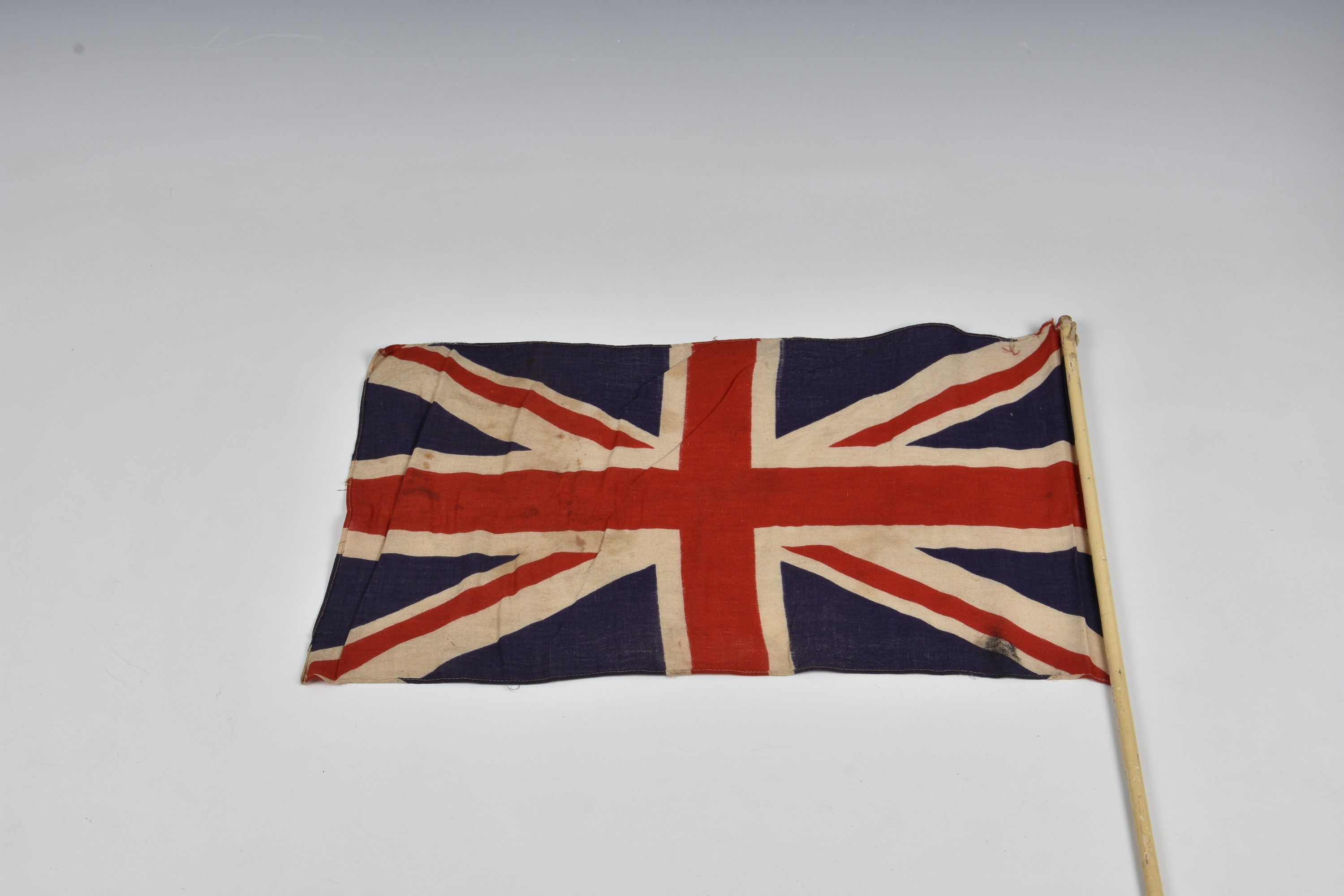 Three 1940s handheld Union jack linen flags, the largest 27 15in. (68.z x 38.2cm.), together with