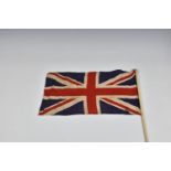Three 1940s handheld Union jack linen flags, the largest 27 15in. (68.z x 38.2cm.), together with
