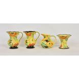 A pair of Wade Heath 1930’s sunflower pattern hand painted jugs, 7 ¾ in. (19.7cm.) high, with
