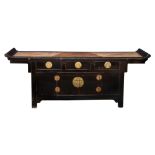 A Chinese black lacquered elm wood low chest, probably Qing Dynasty, mid-19th century, the rattan