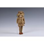 A WWII British Norah Wellings felt doll in 'ATS' uniform, 12in. (30.5cm.) tall Very good, slightly