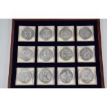 Numismatics interest - American Mint 'The History of Christianity' twelve piece coin set, limited