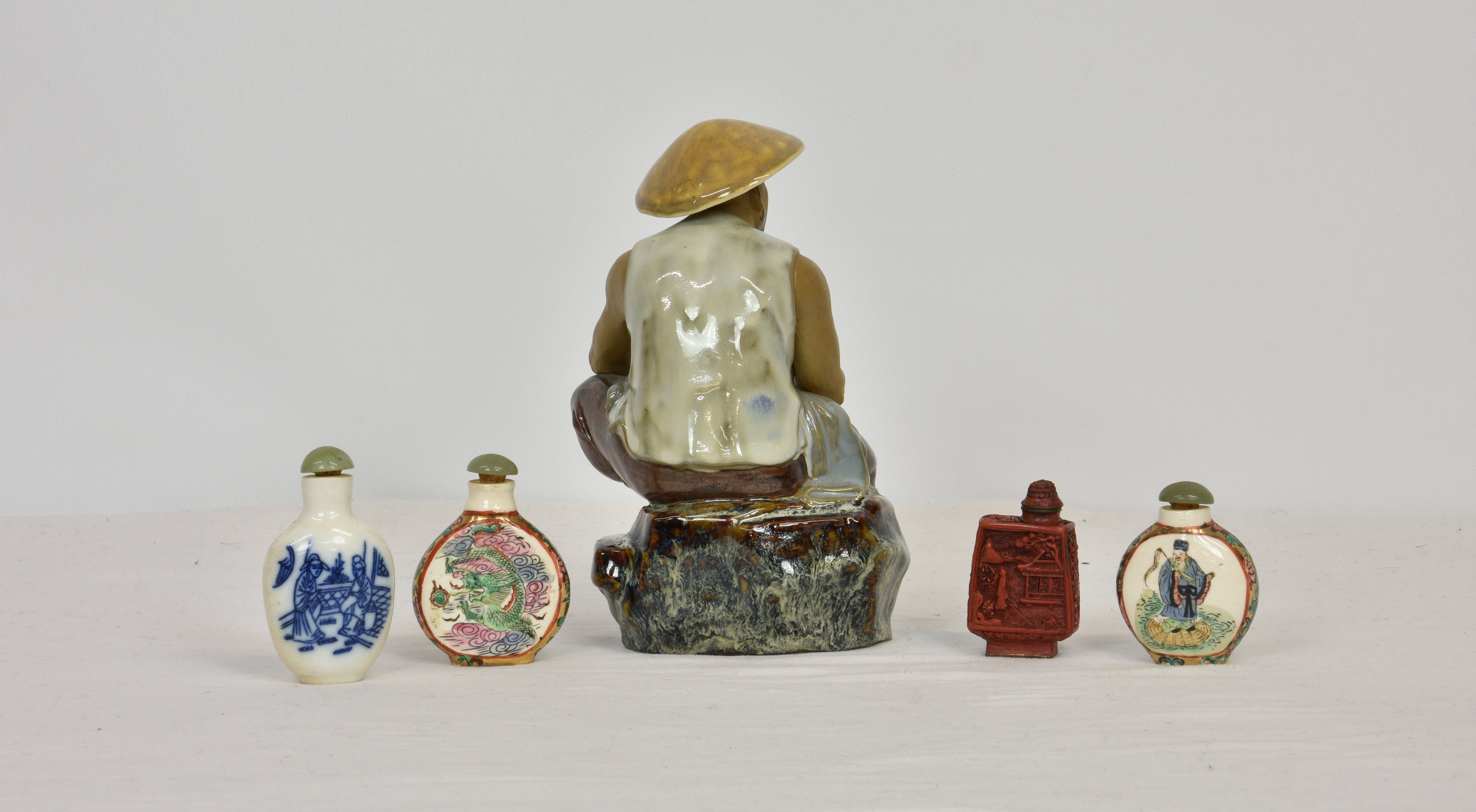 Four Chinese snuff bottles, three porcelain and one cinnabar lacquer, with stoppers, all with - Bild 2 aus 2