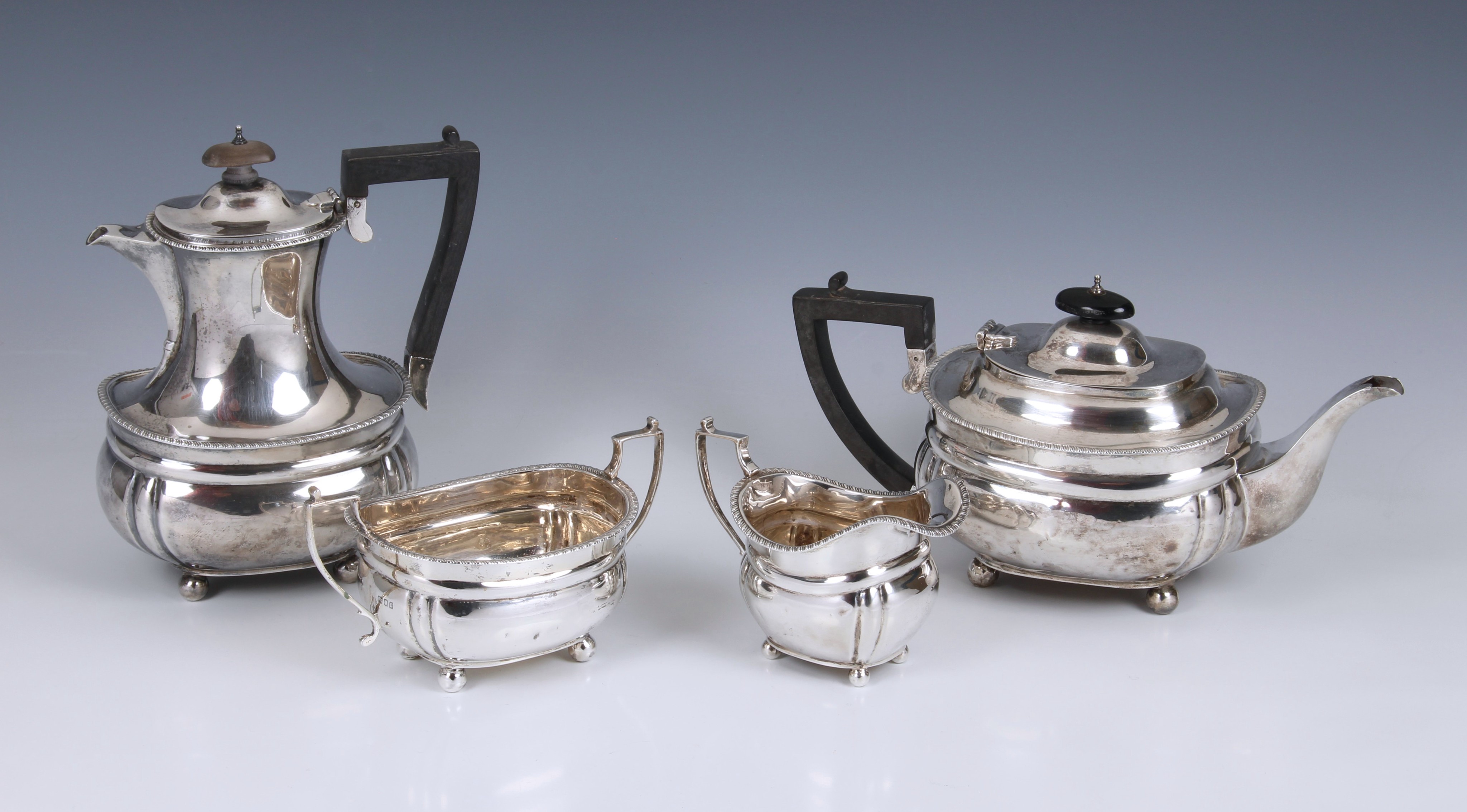 A George V silver four piece tea service, C S Harris & Sons Ltd, London, 1918/19, of bombe form with