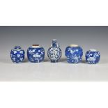 Four Chinese blue and white prunus blossom ginger jars, 20th century, three with dentil band to