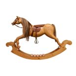 A contemporary laminated plywood rocking horse, bow type, with real horse hair mane etc, leather