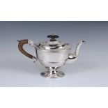 A Victorian silver pedestal teapot, Thomas Hayes, Birmingham, 1897, of oval pedestal form, with leaf