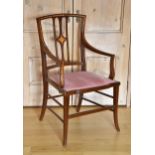 An Edwardian satinwood and mahogany open armchair, the angular back with pierced, diamond patera