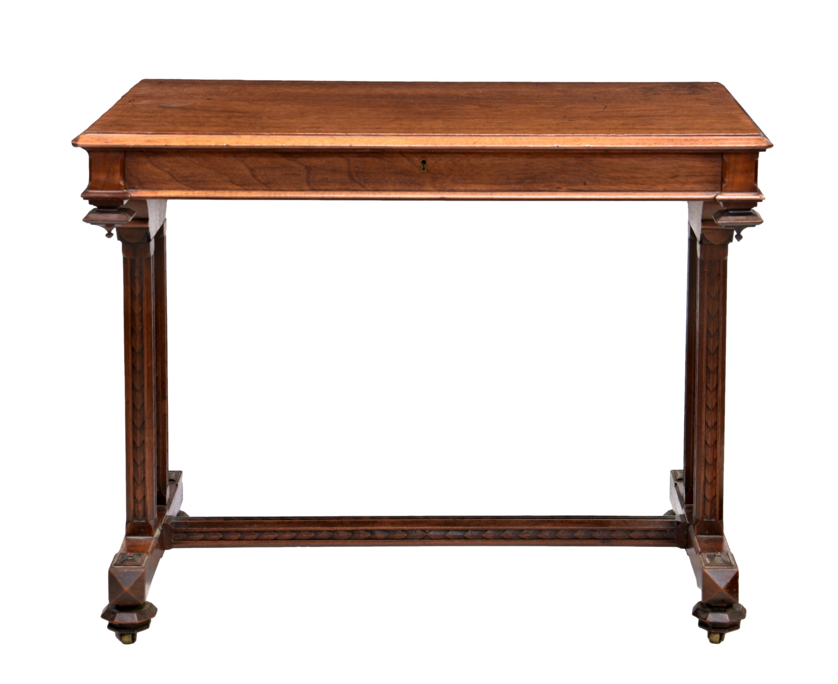 A Victorian walnut centre table by Gillows, stamped 'Gillow' to drawer, the chamfered edged