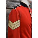 A Guernsey Militia scarlet tunic, for a Sergeant of the North regiment, eight silvered buttons to