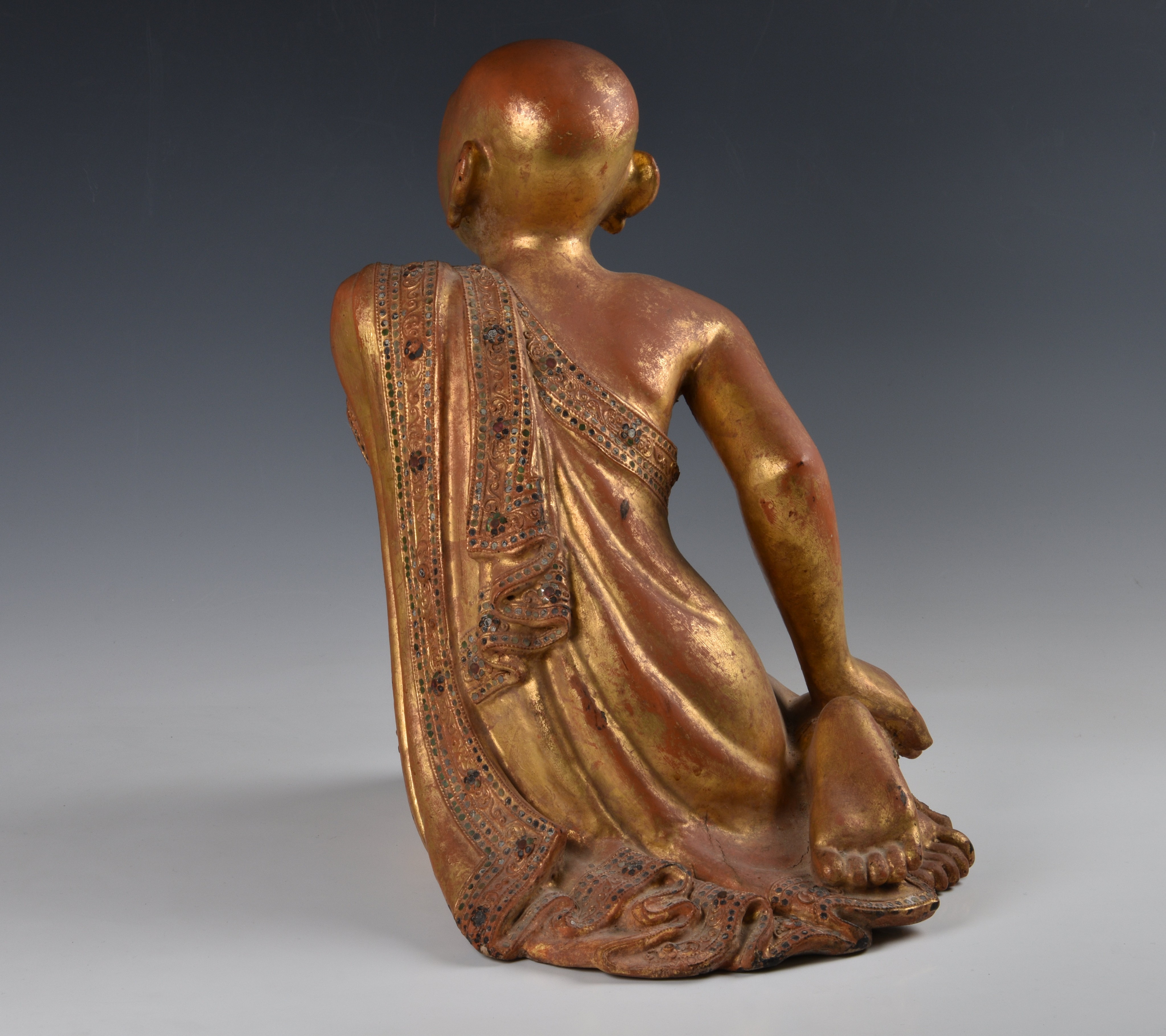 A Burmese Mandalay carved, lacquered and jewelled gilt wood figure of a seated monk, probably late - Image 6 of 9