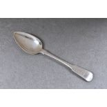 A Channel Islands silver fiddle pattern table spoon, maker's mark GH with crown above, struck