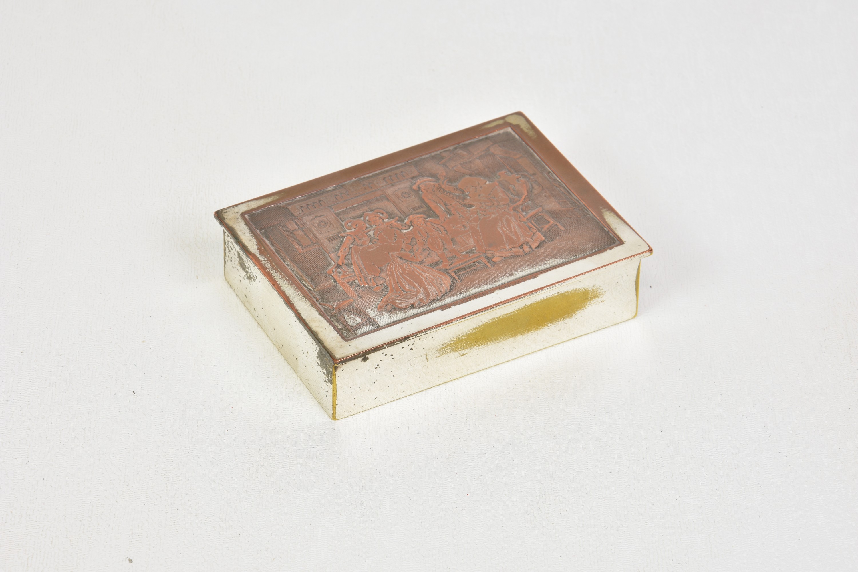 A 19th century silver plate on copper snuff box, with raised decoration of figures in a 17th century