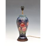 A Moorcroft Pottery baluster vase lamp, 'finches' pattern, dark blue ground, total height 18¼in. (