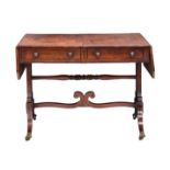 A Regency mahogany sofa table, the top with clipped corners, cross banded over two ebony strung