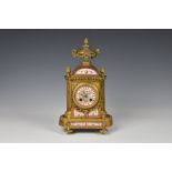A 19th century French ormolu half hour striking mantel clock, the case with a urn finial with
