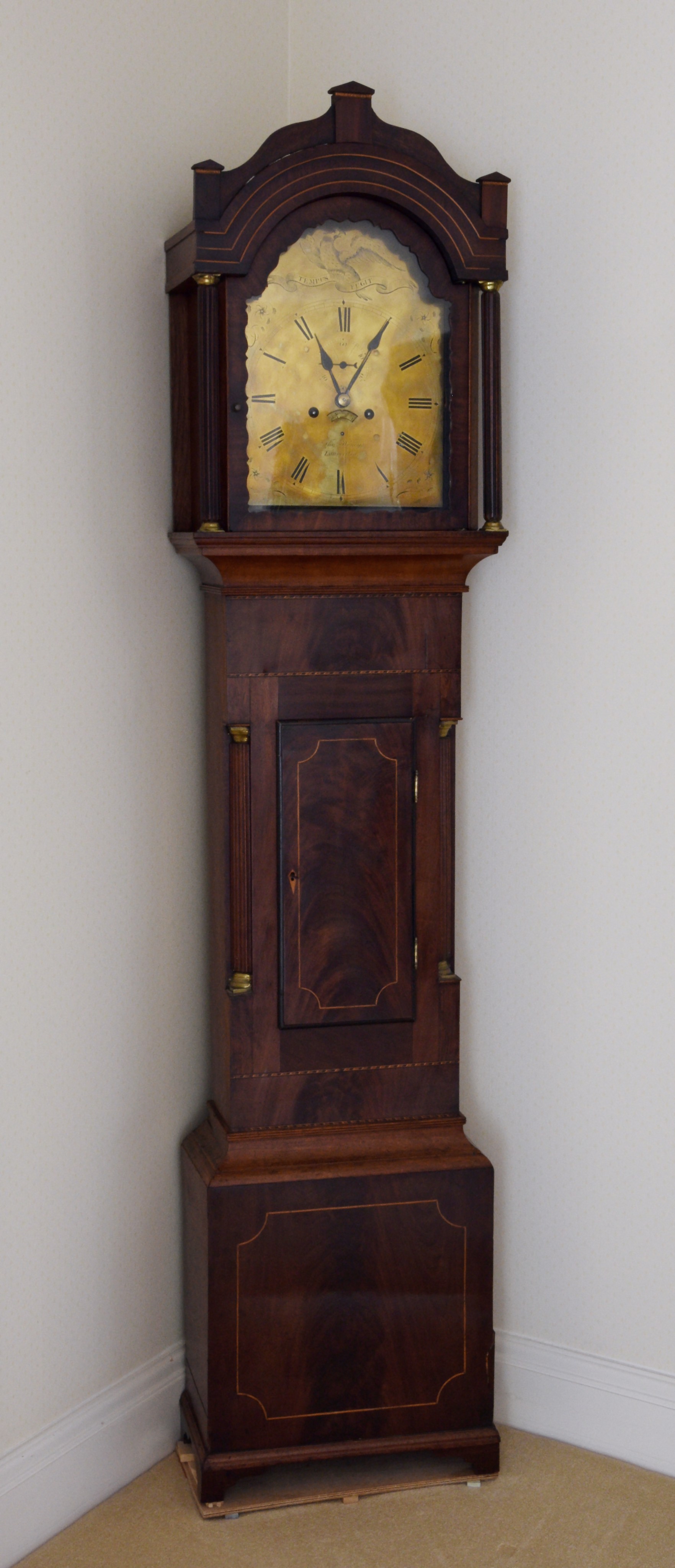 An early 19th century West Country inlaid mahogany eight day longcase clock by Thomas Honey of