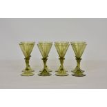 A set of eight Continental green wine glasses, mid-20th century, with rounded spiral design funnel