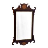 A 19th century George II style inlaid mahogany and parcel gilt fretwork mirror, the bevelled