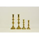 A pair vintage brass candle pusher sticks, each having shaped knops to shaped square bases, push