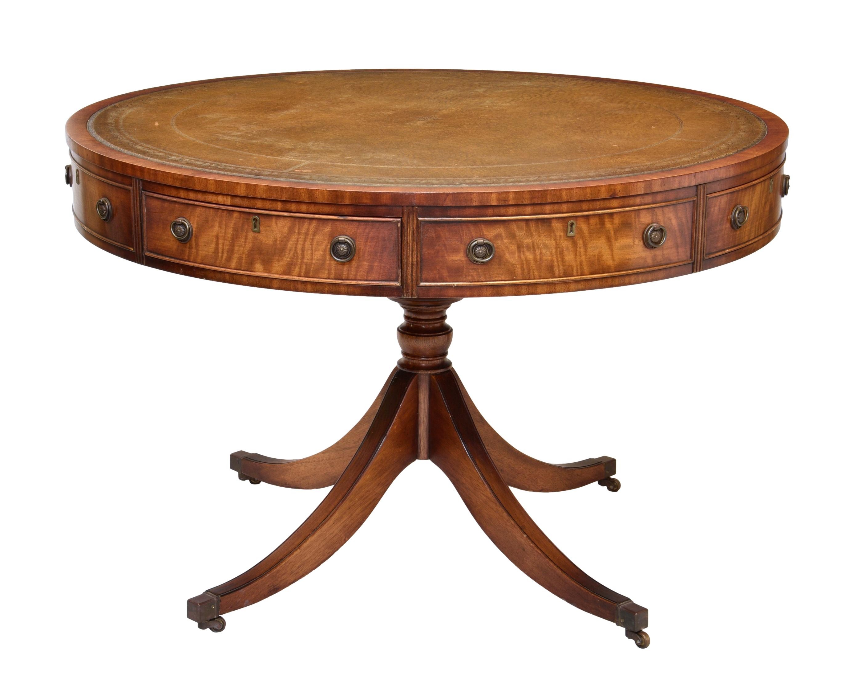 A Georgian style leather and mahogany drum table, by Reprodux, late 20th century, the revolving