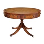 A Georgian style leather and mahogany drum table, by Reprodux, late 20th century, the revolving