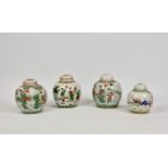 A matched pair of Chinese porcelain ginger jars with covers, with ladies and children in garden