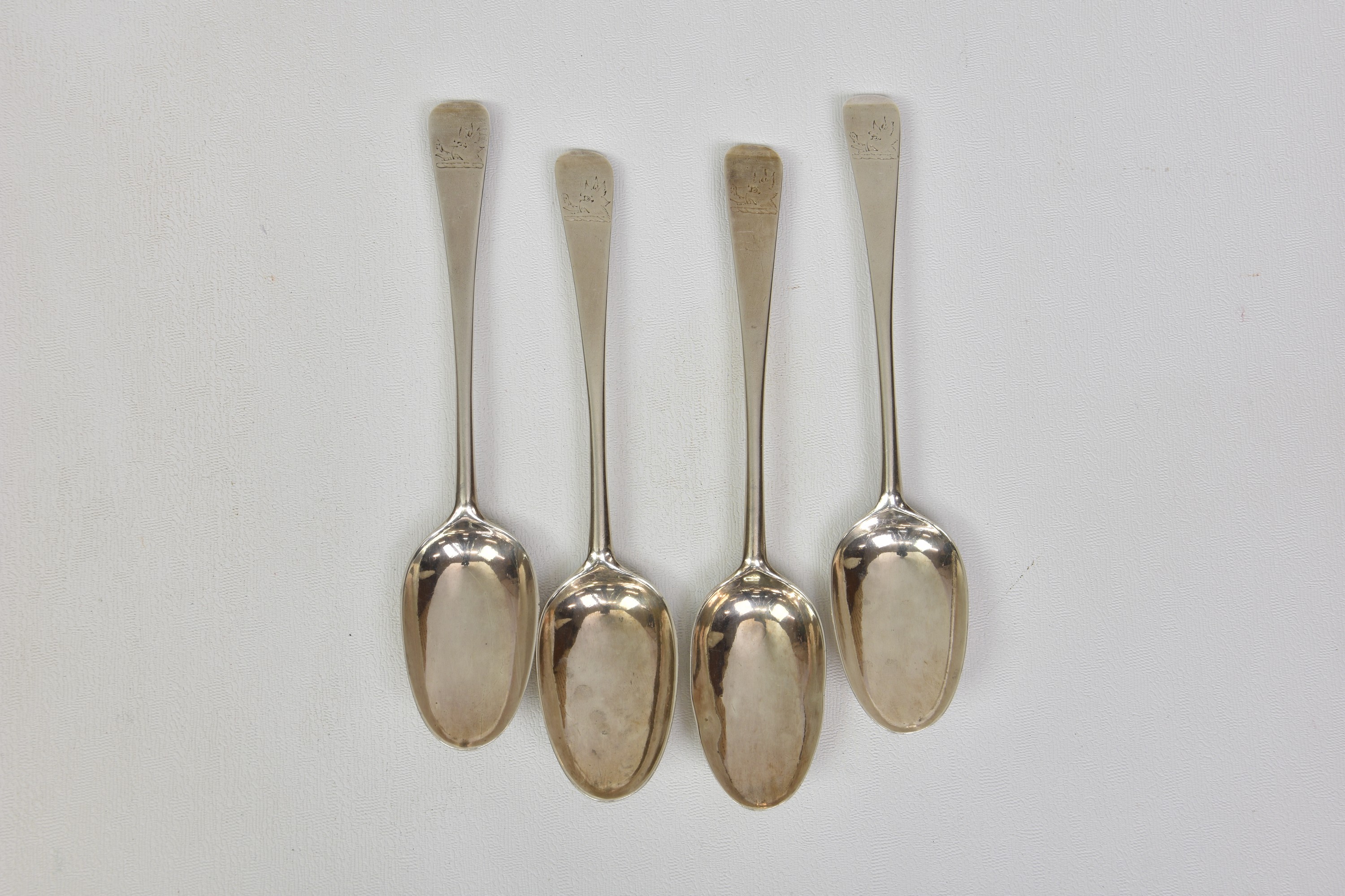 Four mid 18th century Irish Old English pattern silver dessert spoons, circa 1760, maker's mark '
