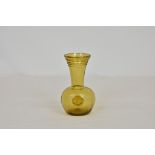 A Whitefriars free blown amber coloured glass bud vase, with ribbed spiral decoration to top of