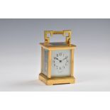 A French gilt brass carriage clock, c.1900, the white enamel Arabic dial signed 'Snow & Ashworth