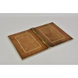 An Anglo-Indian horn veneered, ivory and sandalwood book cover, 19th century, the shallow cover with