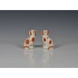 A pair of Victorian miniature Staffordshire dogs, 4¼in. (10.8cm.) high. (2). * Good condition with