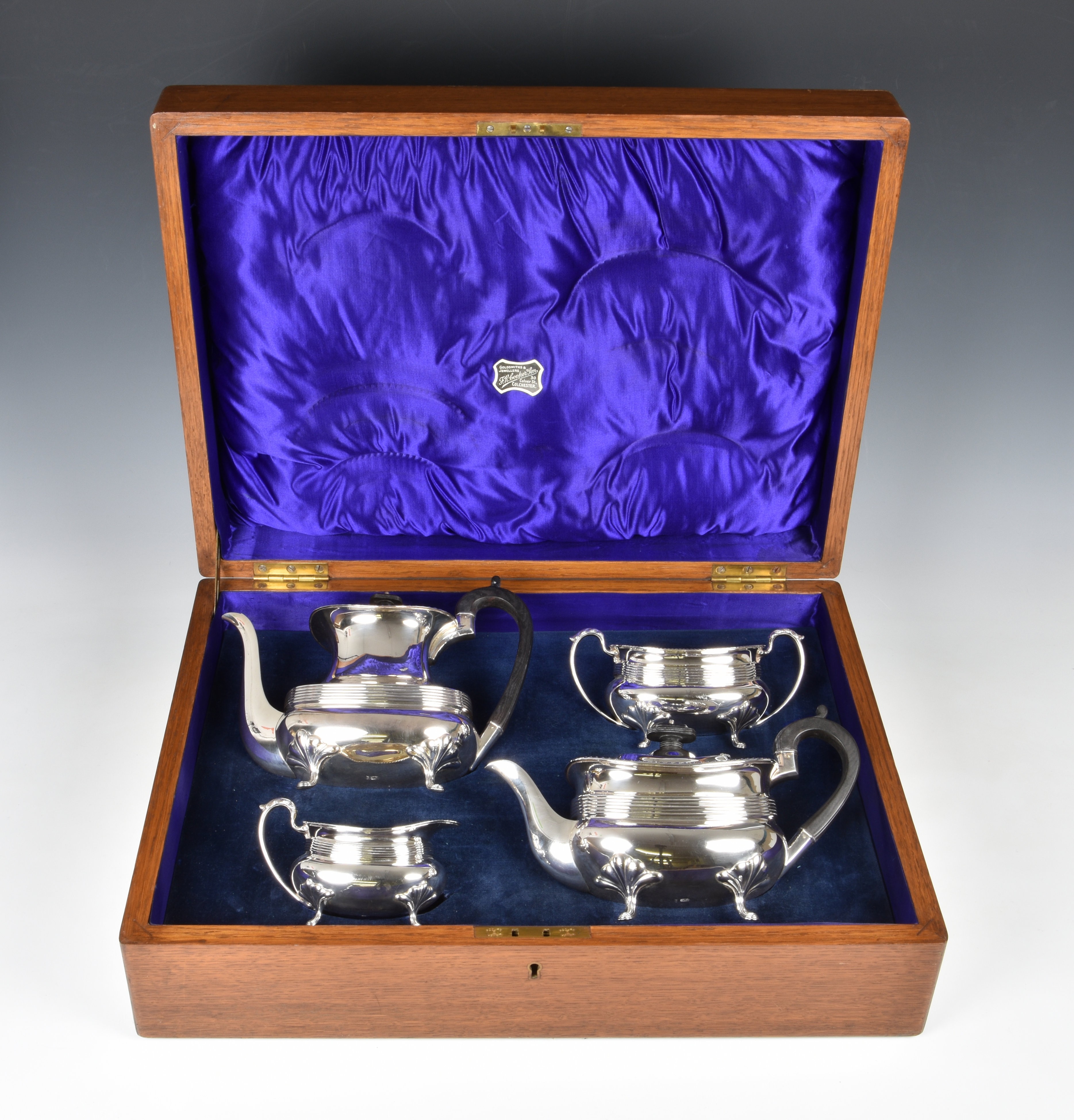An oak cased George V silver four piece tea and coffee service, Joseph Rodgers & Sons, Sheffield