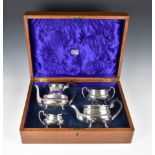 An oak cased George V silver four piece tea and coffee service, Joseph Rodgers & Sons, Sheffield