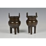 A matched pair of Japanese miniature bronze tripod censers, probably late 19th / early 20th century,