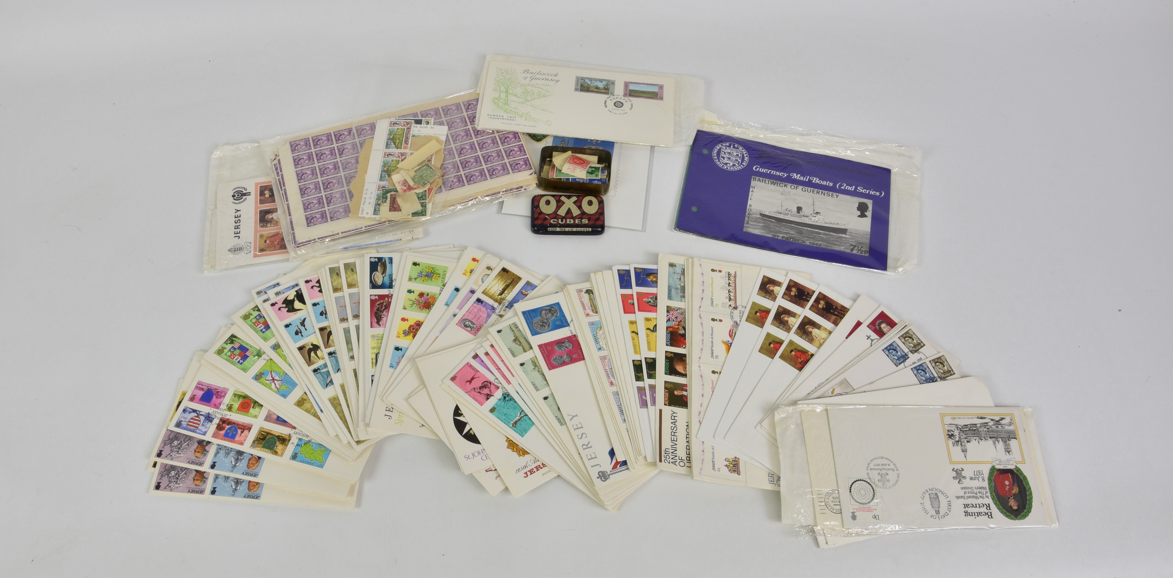 A collection of Jersey / Guernsey and UK stamps, comprising over eighty Jersey presentation packs;