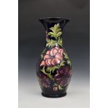 A large Moorcroft Pottery floor standing baluster vase, with flared rim, 'anemone' pattern, on