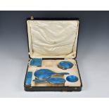 A cased George V silver and guilloche enamel dressing table set, Henry Clifford Davis, Birm. 1924,