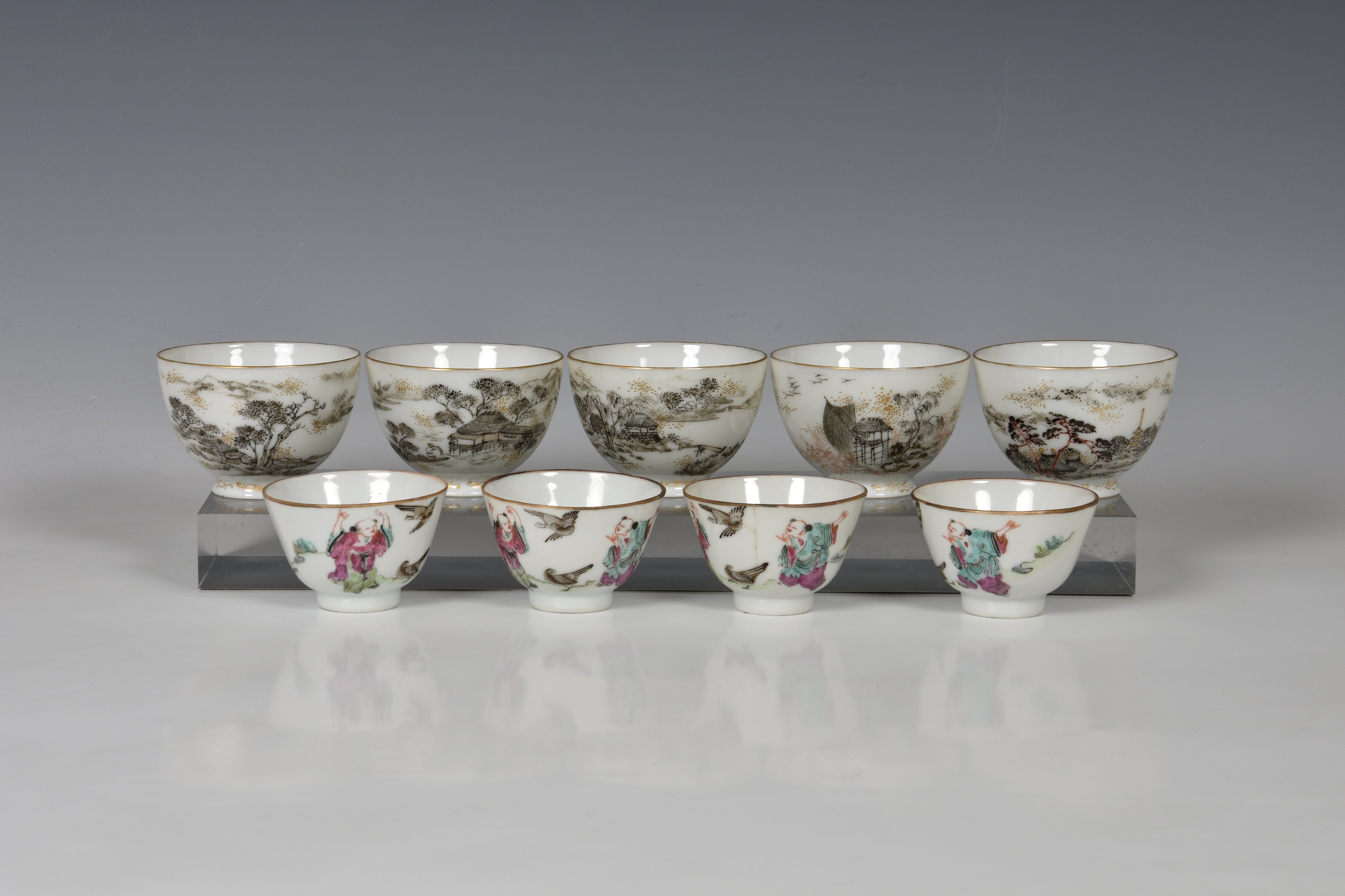 A set of five Chinese porcelain tea bowls, 20th century, finely enamelled in black, iron red and