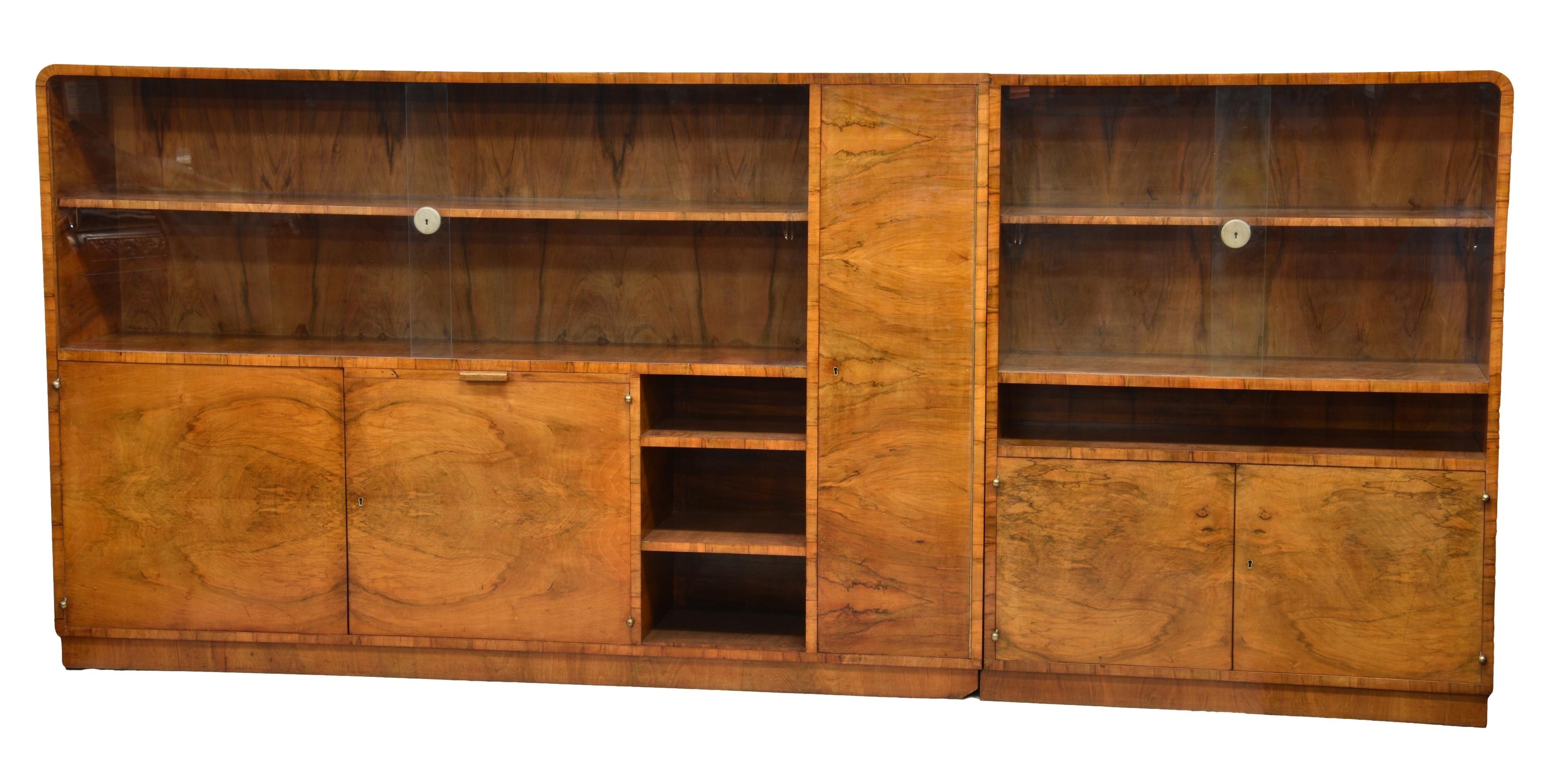 An Art Deco figured walnut two part bookcase cabinet, Austrian, 1930s, of rectangular form with