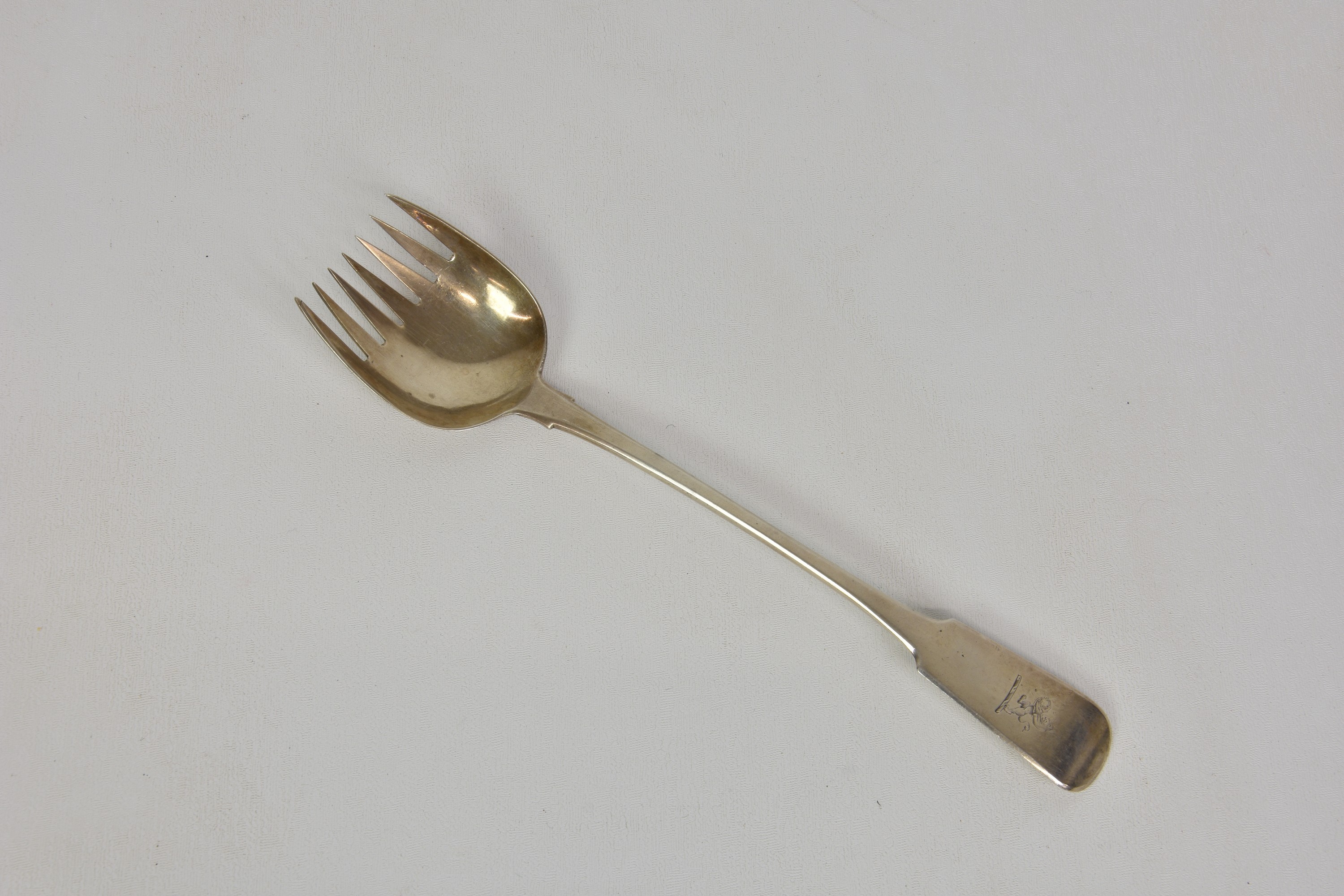 A George III Irish silver fiddle pattern salad serving fork, James Scott, Dublin, 1814, rearing