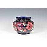 A Moorcroft Pottery jardinière, by Walter Moorcroft, of squat ovoid form with short flared rim