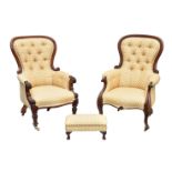 A matched pair of Victorian carved walnut showframe button back armchairs, the spoonbacks with