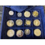 COINS - Two blue presentation cases of coins including 10 Silver Proofs in capsules (230g approx)
