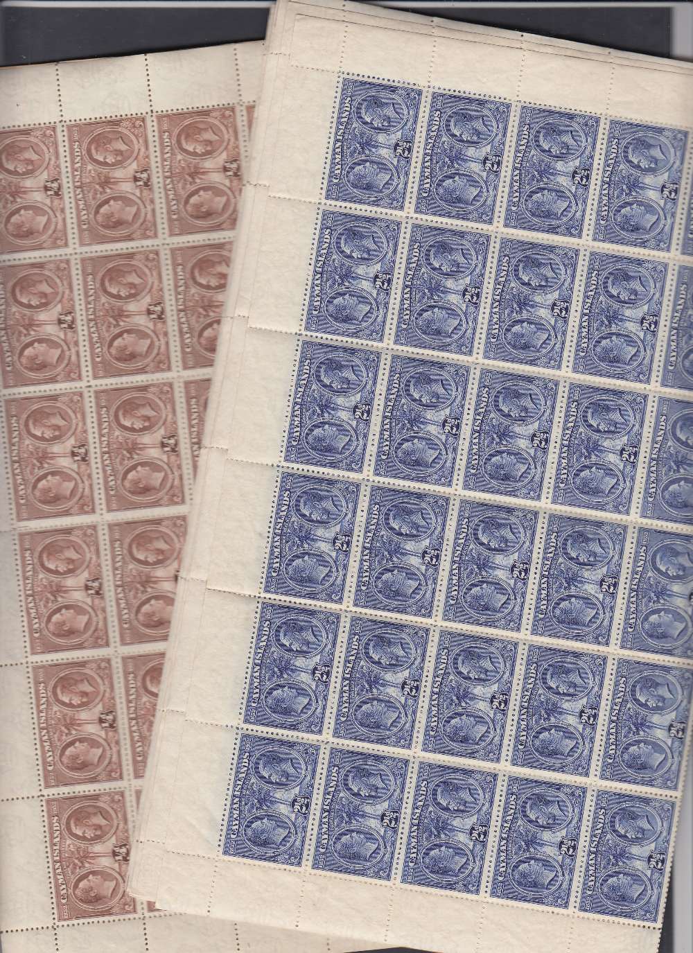 STAMPS BRITISH COMMONWEALTH British Guiana and Cayman unmounted mint in sheets and part sheets