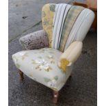 A modern semi-wingback armchair upholstered in various fabrics