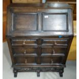 An oak period style bureau with fall front over 3 drawers