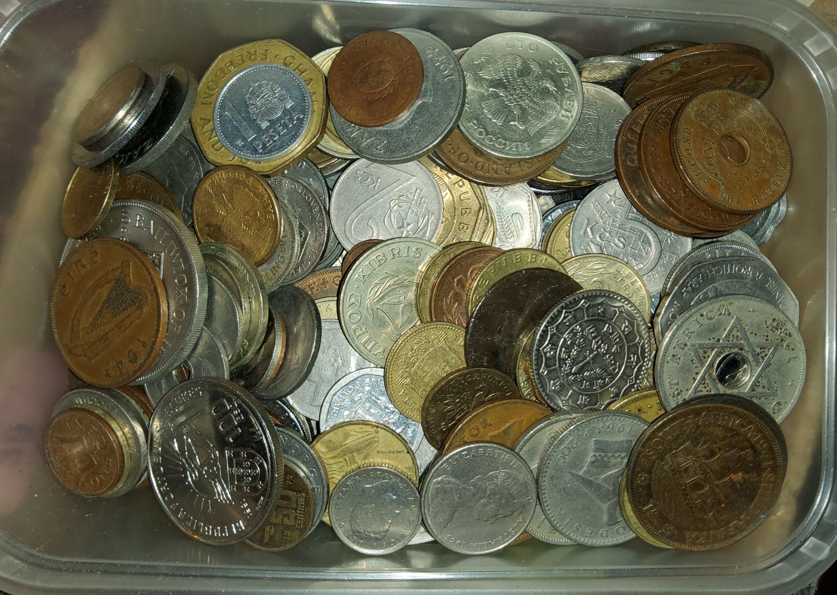 A collection of world coins weighing in at 1.5 kilos